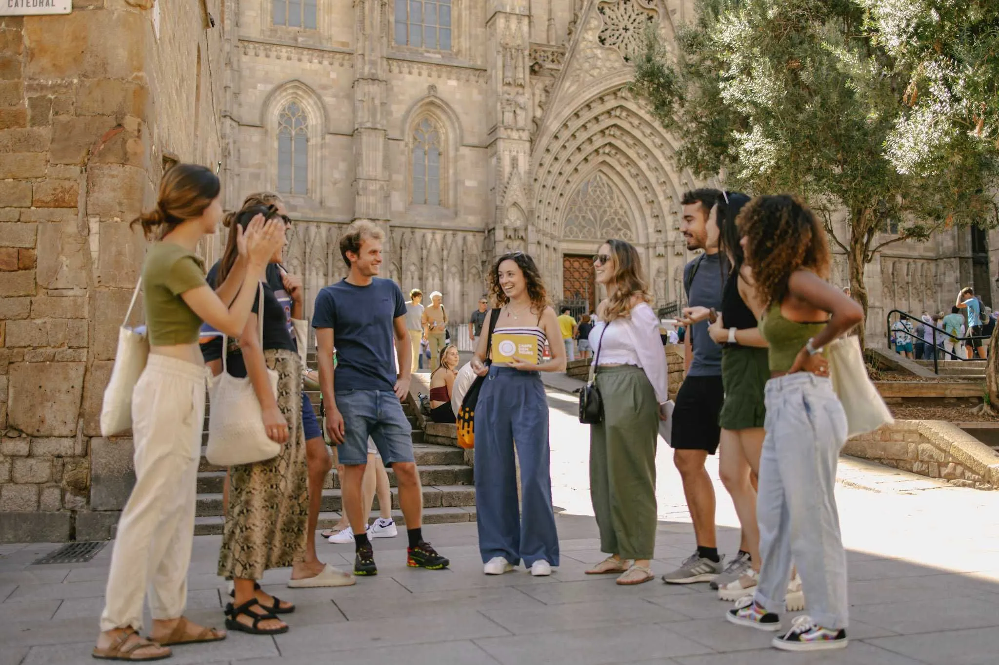 Group enjoying a Carpe Diem walking tour in front of the Barcelona Cathedral