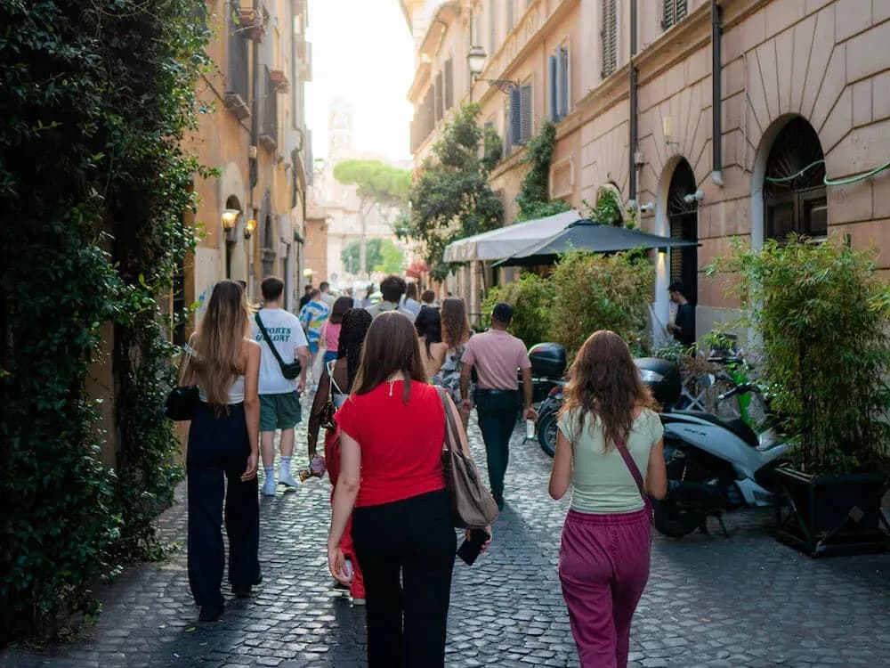 Group-walking-through-Monti-enjoying-a-tour-while-avoiding-scams-in-Rome-1