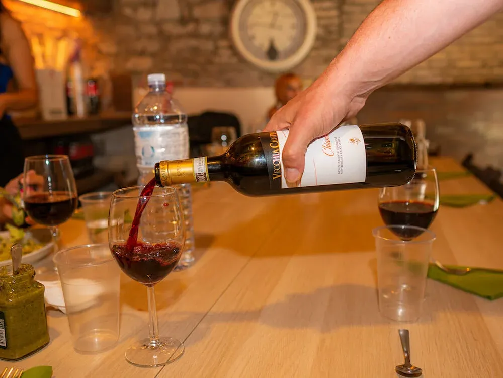 Trying a local glass of Chianti during our Trastevere Food Tour