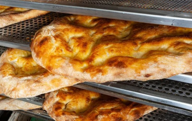 Pieces of freshly baked Schiacciata, a traditional Tuscan flatbread