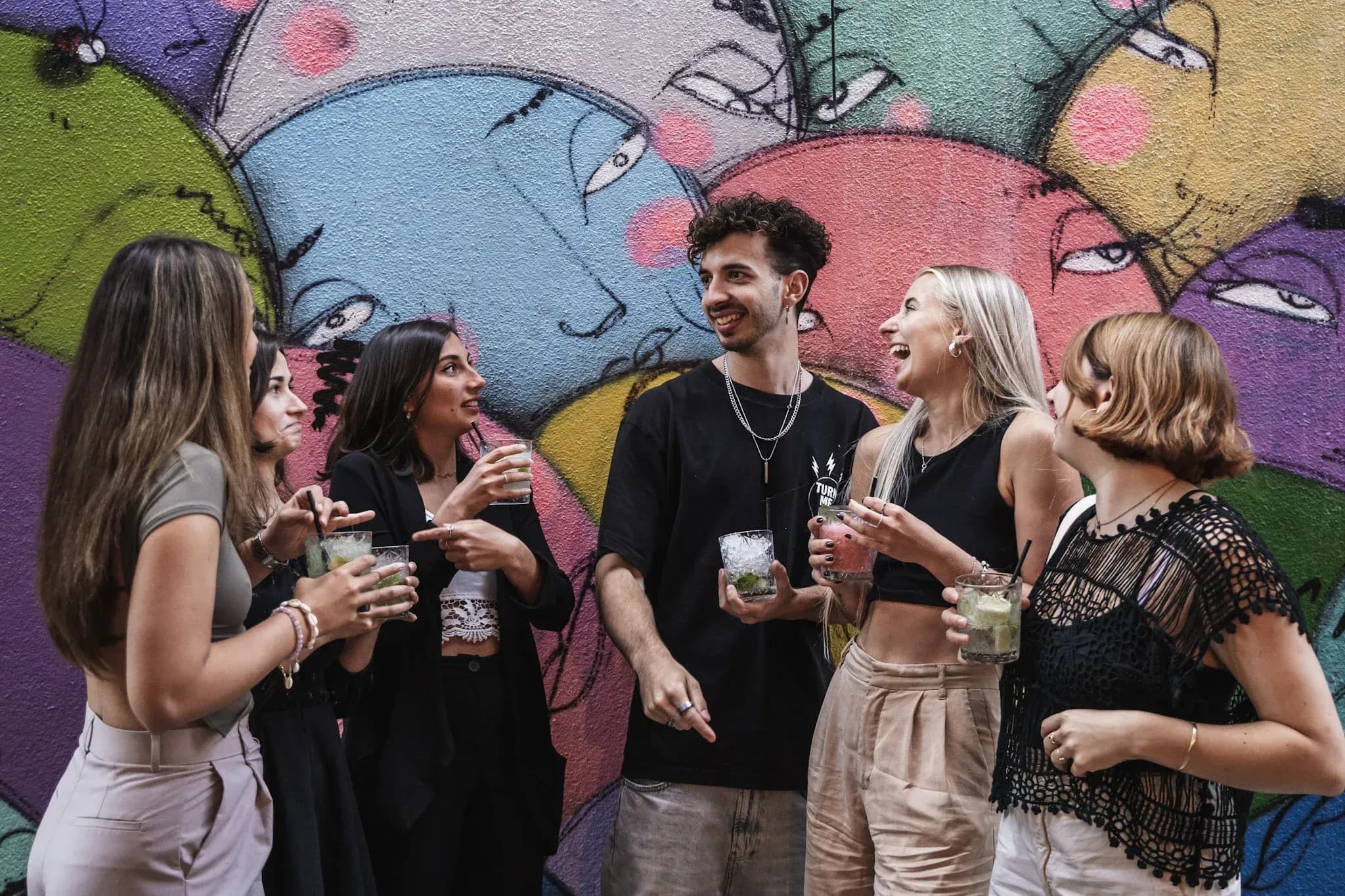 Group with umbrellas enjoying a Carpe Diem Lisbon Tipsy Tour - cover photo